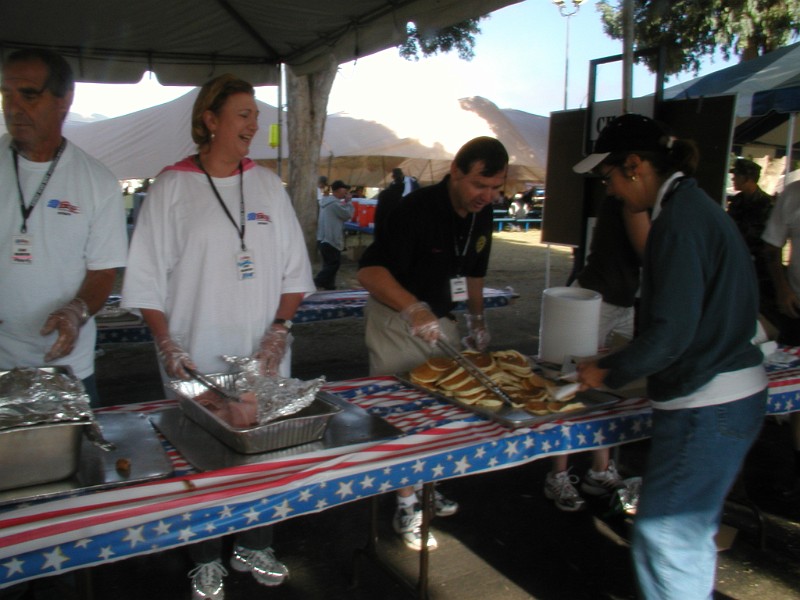 ROTARY PRESIDENT DAVID BEHRING SERVING PANCAKES AT 6AM WITH ROTARY.JPG