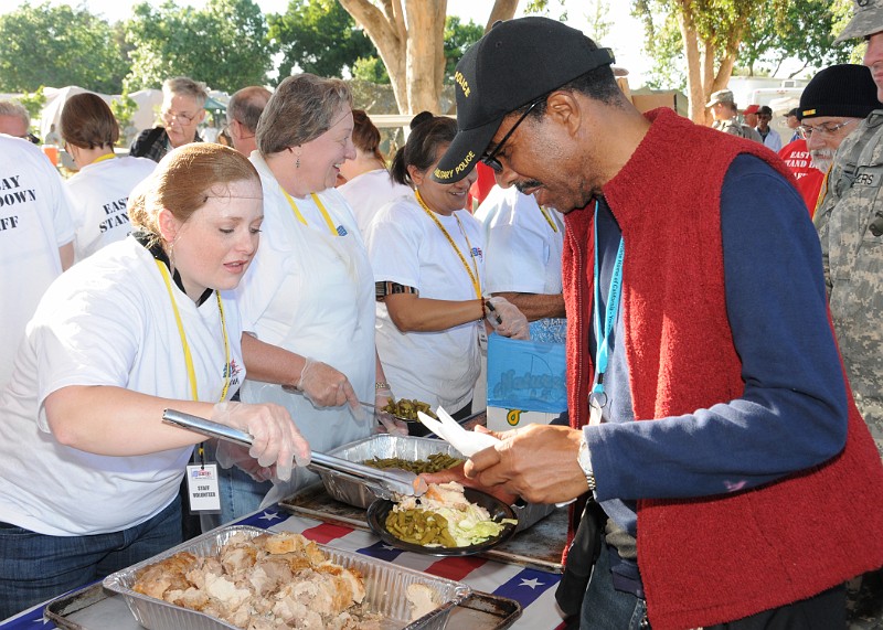 EBSD13.jpg - 100805-A-4869-542 webPleasanton, CA  --  The Church of Jesus Christ of Latter Day Saints, Pleasanton, CA Stake member Sarah Garber serve Wesley Mays, an Army Military Police Veteran, some turkey meat  during the East Bay Stand Down 2010 held in Pleasanton, California on August 5-8, 2010.  On August 5, approximately 992 Veterans and volunteers alike were fed during the evening meal sponsored by The Church of Jesus Christ of Latter Day Saints, Pleasanton, CA Stake members.Photo Credit: CPT Anthony John, USAR Joint Special Troops Support Command Public Affairs Officer